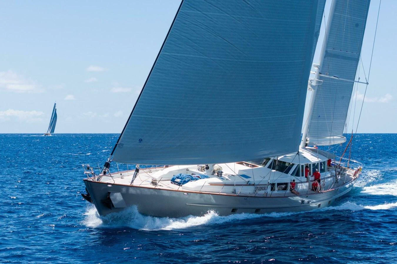 A sleek sailing yacht glides gracefully across the open sea under full sail. aboard CATALINA Yacht for Sale