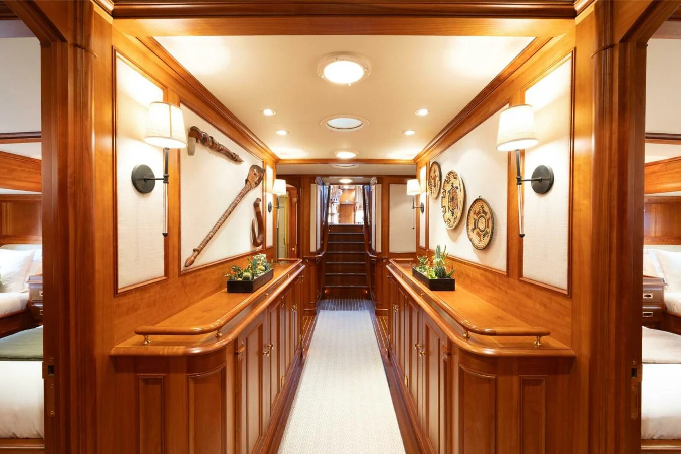 A beautifully crafted wooden hallway with elegant lighting and decor. aboard CATALINA Yacht for Sale