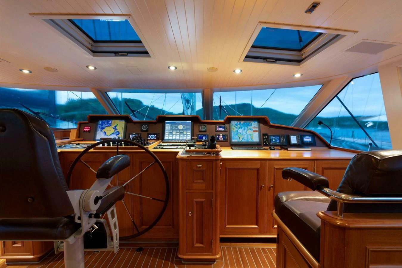 The helm station features state-of-the-art navigation equipment and luxurious wood finishes. aboard CATALINA Yacht for Sale