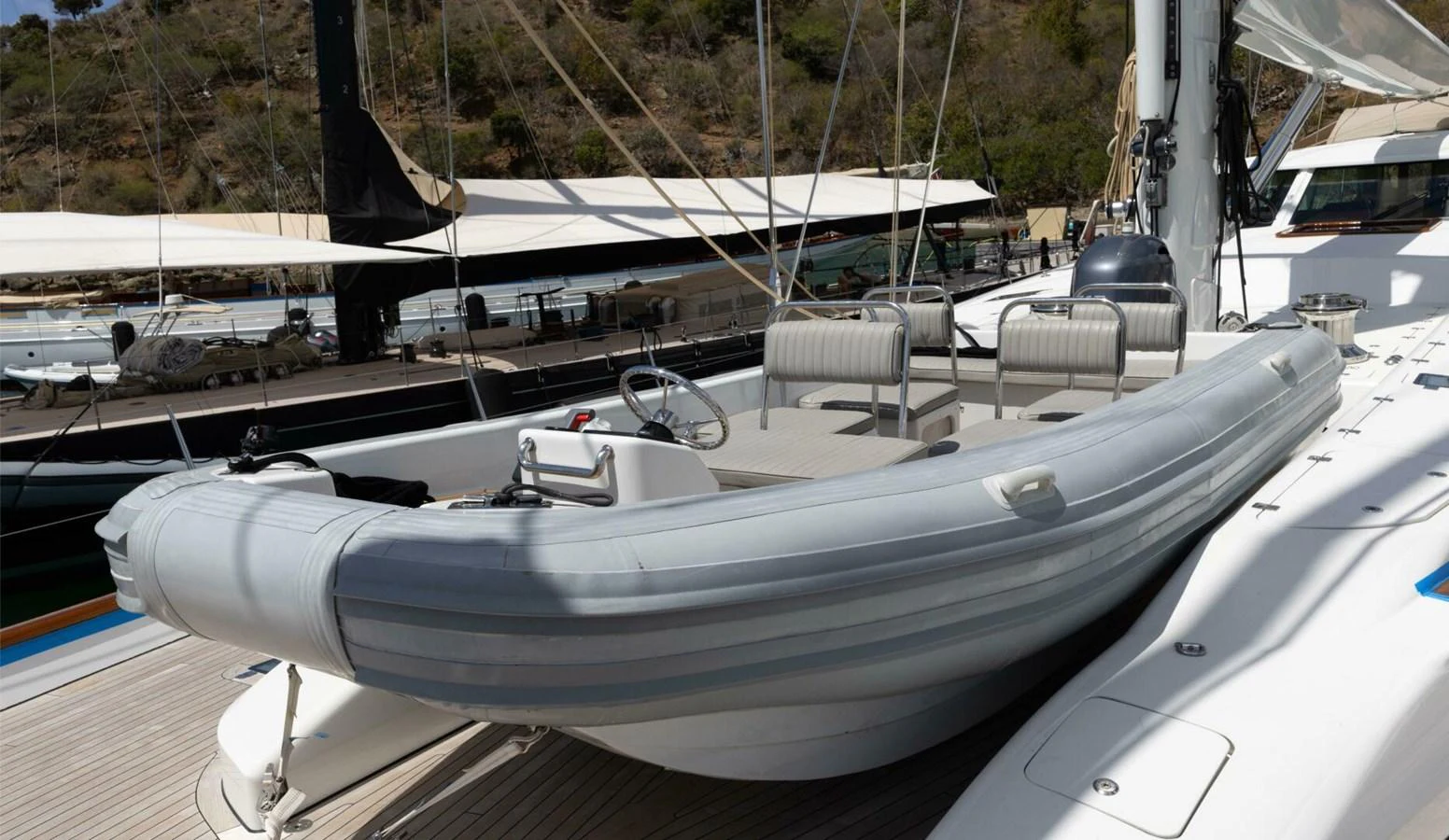 A sleek and modern tender is securely positioned on the yacht's deck, ready for excursions. aboard CATALINA Yacht for Sale