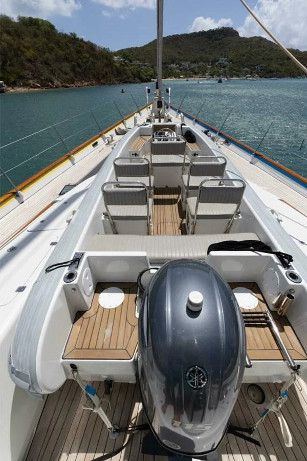 The yacht's deck features a spacious and well-appointed seating area with a view of the surrounding waters. aboard CATALINA Yacht for Sale
