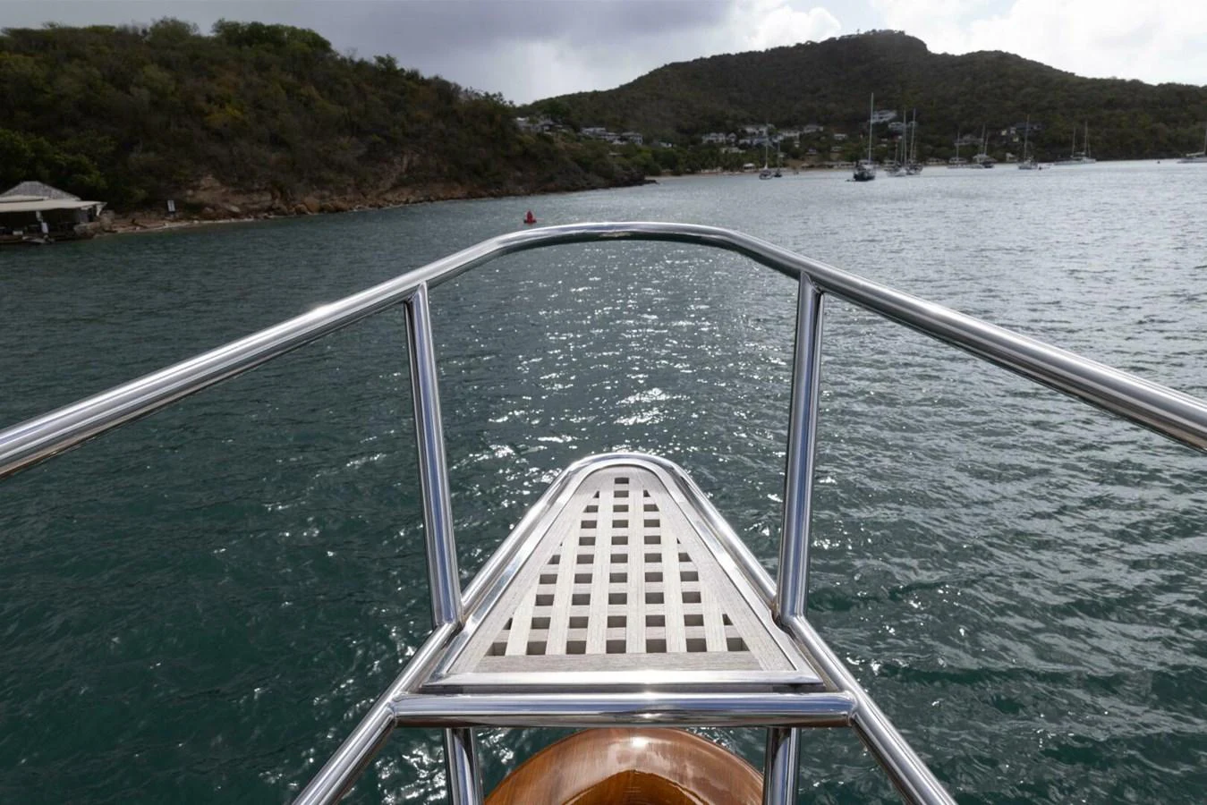 The yacht's bow offers a serene view of the surrounding waters and distant shoreline. aboard CATALINA Yacht for Sale