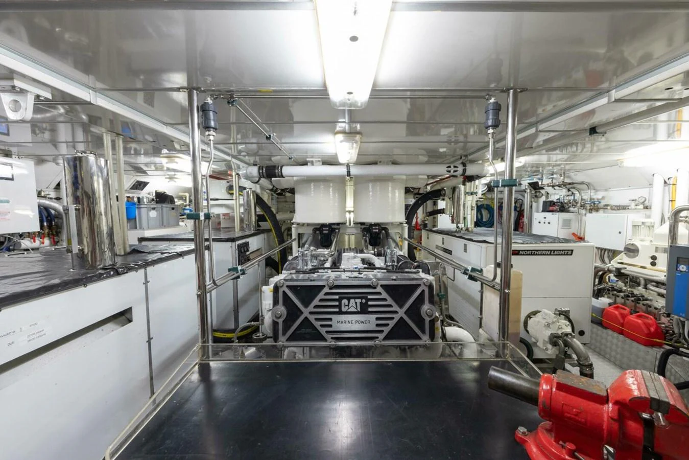 The image showcases the well-maintained engine room of the yacht, featuring a prominent CAT marine engine. aboard CATALINA Yacht for Sale