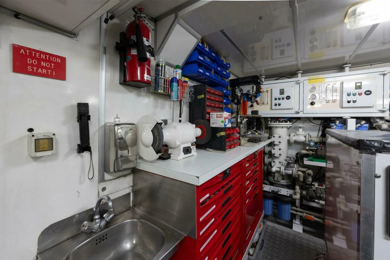 The yacht's engine room is equipped with essential tools and machinery for maintenance and operation. aboard CATALINA Yacht for Sale