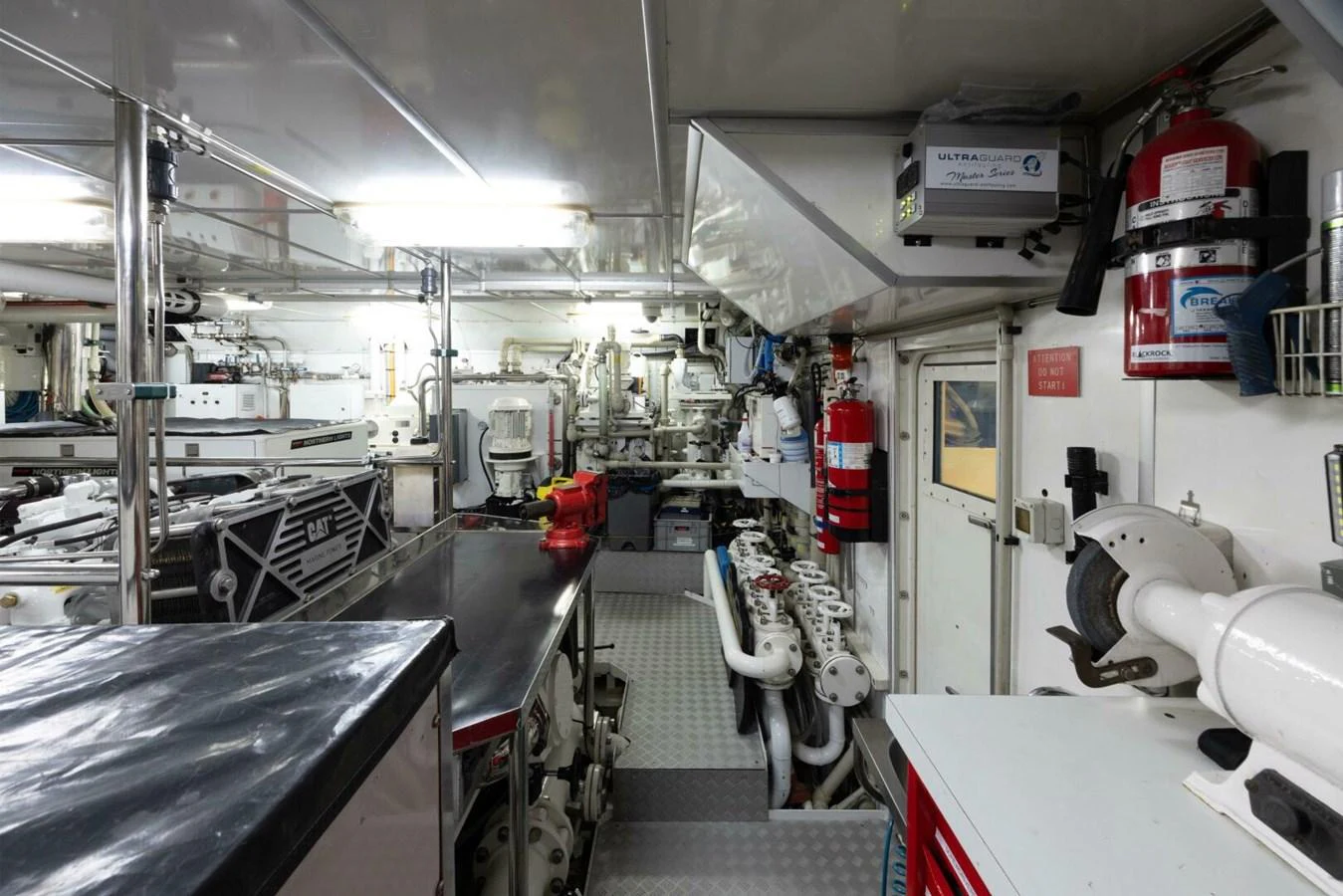 The engine room is equipped with advanced machinery and safety equipment, ensuring optimal performance and safety. aboard CATALINA Yacht for Sale