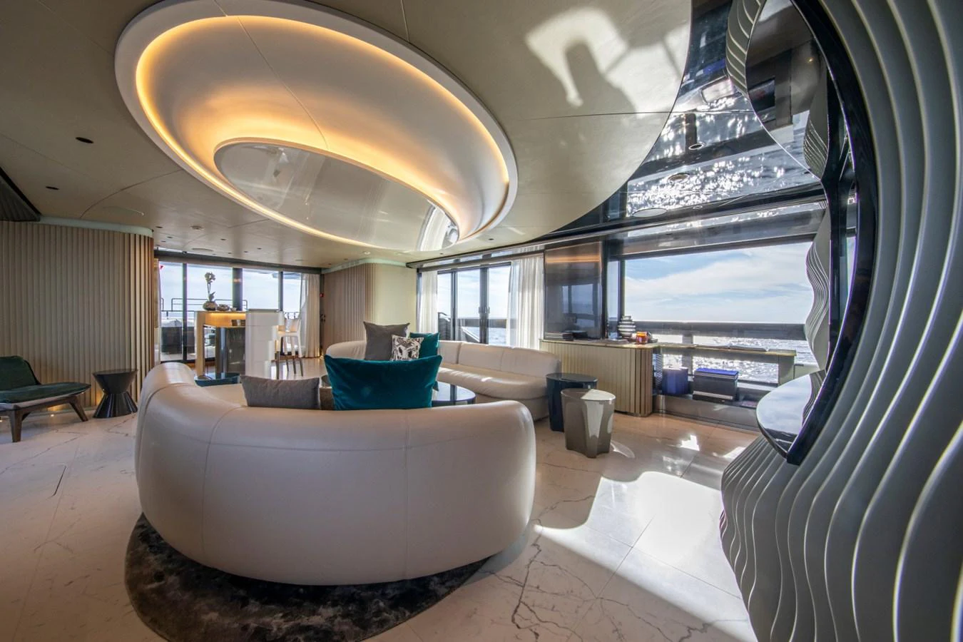 The salon offers a luxurious and modern space with panoramic views and elegant furnishings. aboard PACIFIC PEARL Yacht for Sale