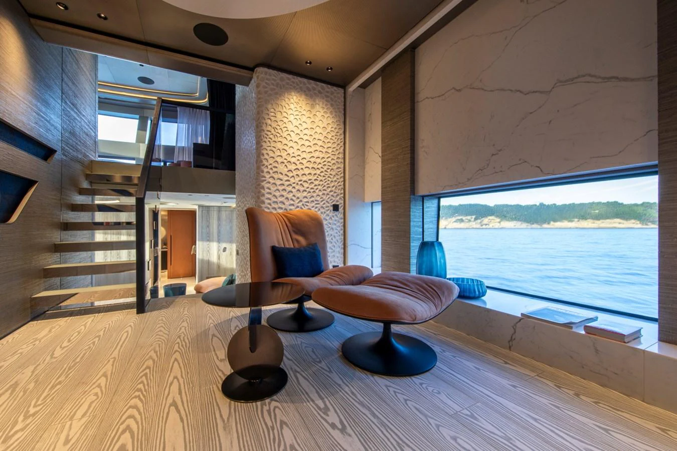 The yacht's interior features a stylish seating area with panoramic ocean views. aboard PACIFIC PEARL Yacht for Sale