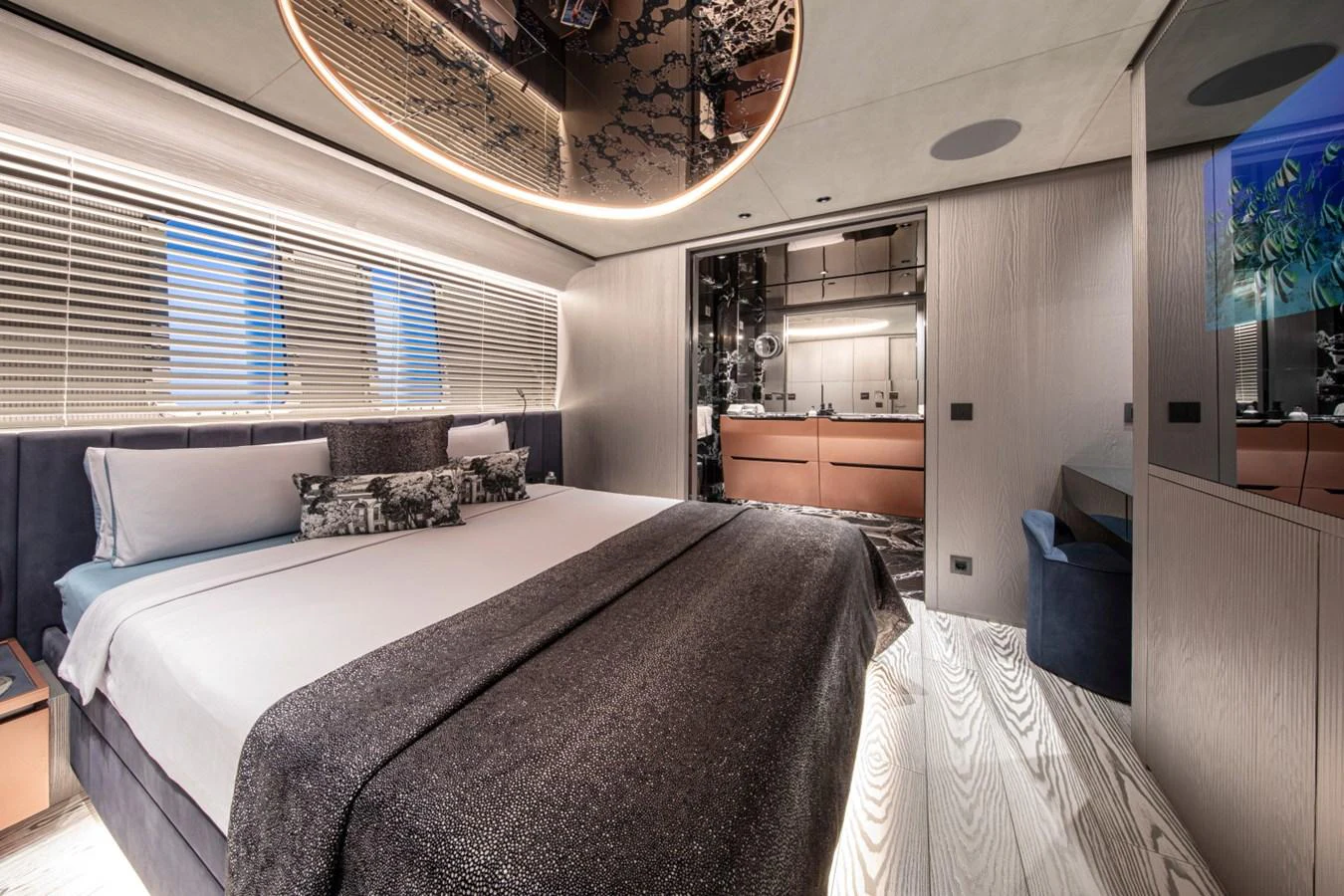 The master stateroom features a luxurious bed with modern decor and ample natural light. aboard PACIFIC PEARL Yacht for Sale