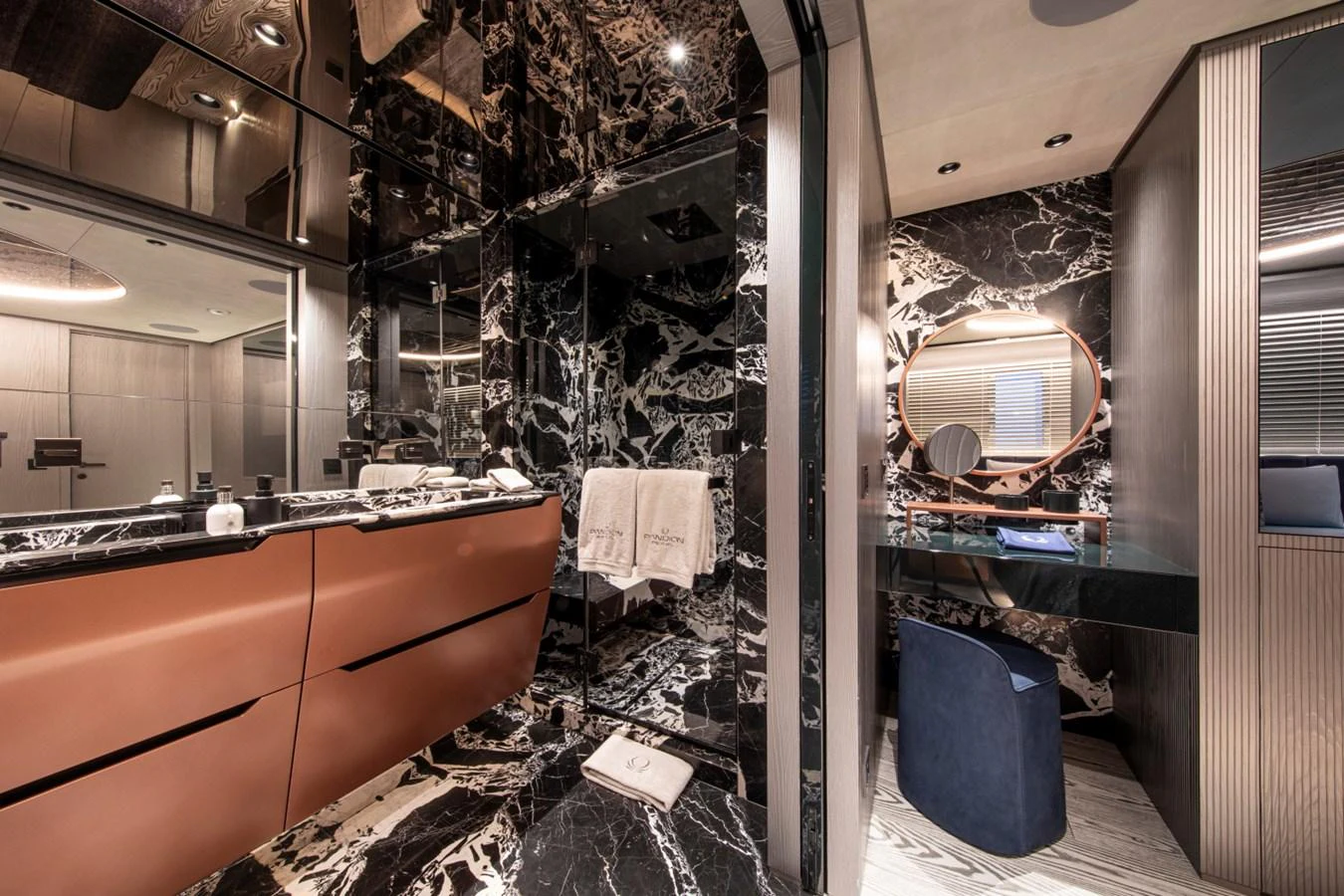 The luxurious bathroom features elegant black marble and modern fixtures. aboard PACIFIC PEARL Yacht for Sale