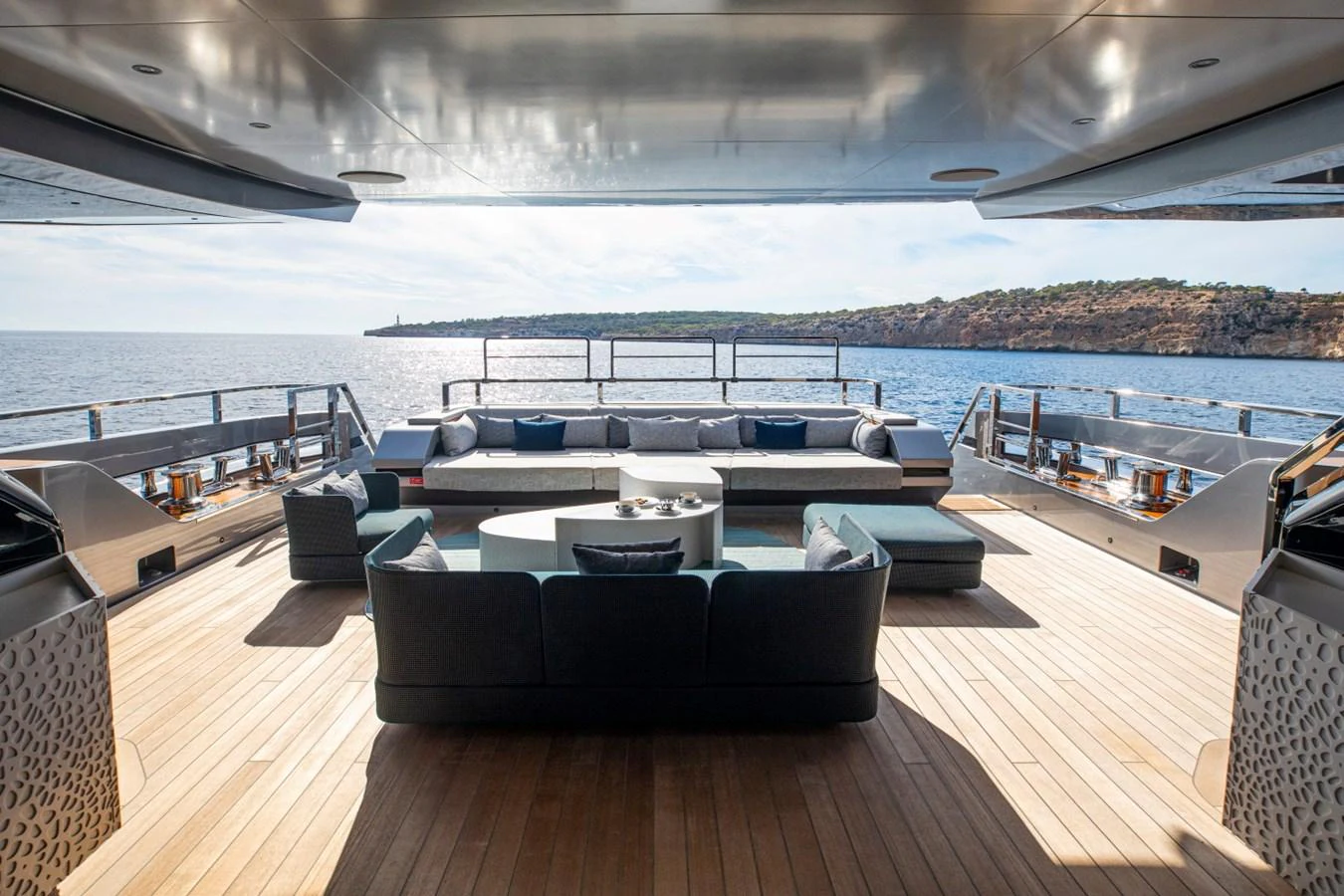 The aft deck offers a spacious and luxurious outdoor seating area with stunning sea views. aboard PACIFIC PEARL Yacht for Sale