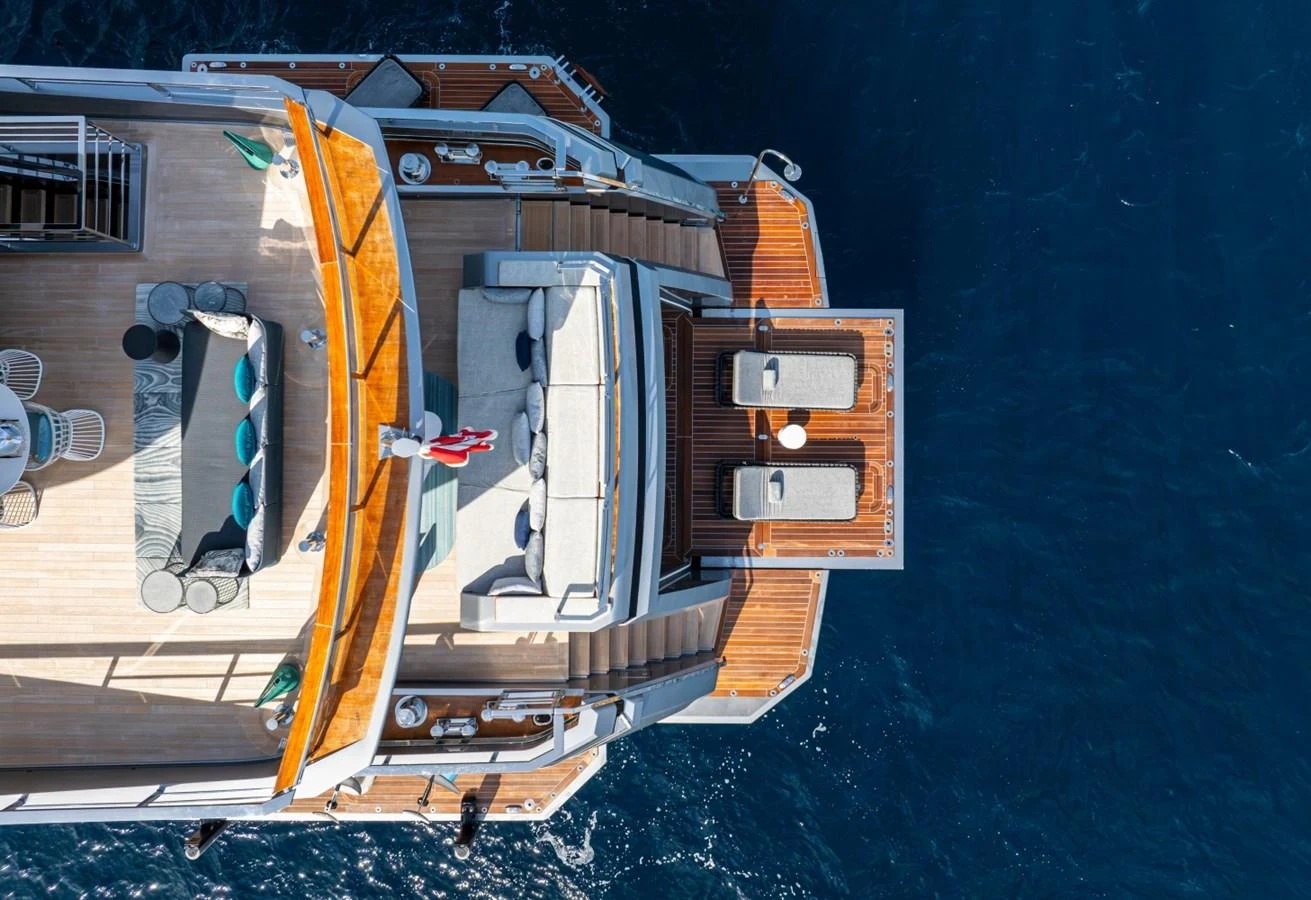 The aft deck of the yacht features luxurious lounging areas with stunning views over the water. aboard PACIFIC PEARL Yacht for Sale