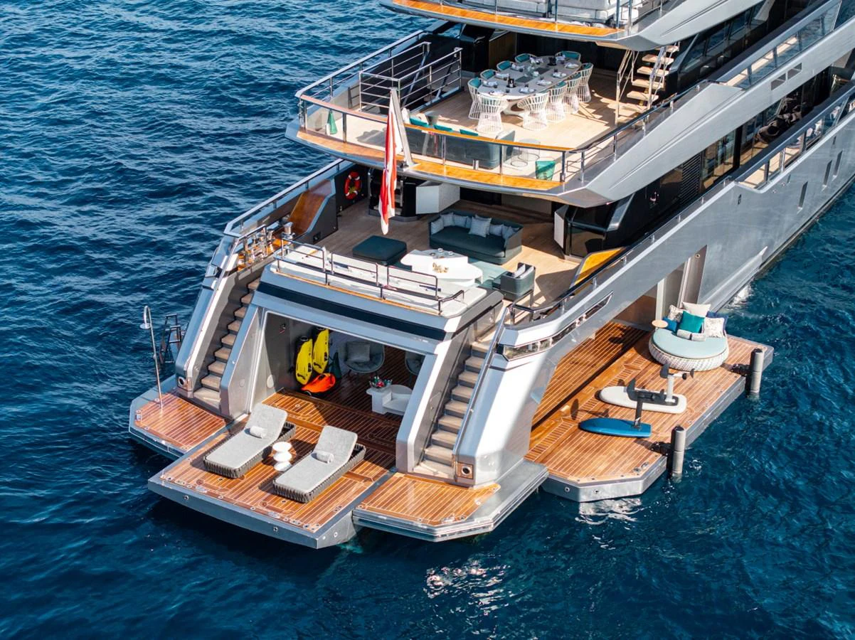 The yacht's aft deck features luxurious lounging areas and direct access to the water. aboard PACIFIC PEARL Yacht for Sale