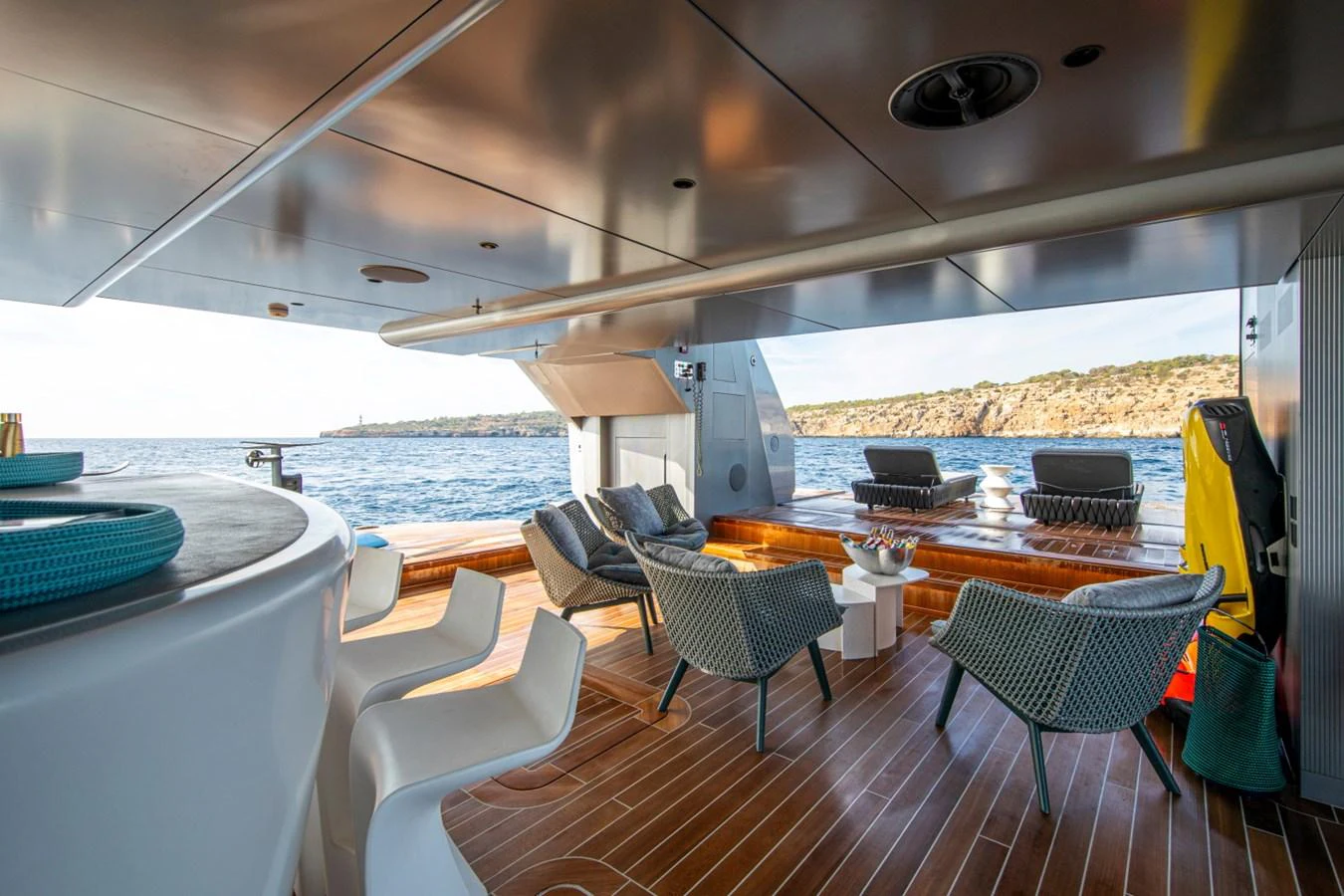 The aft deck offers a luxurious outdoor seating area with stunning views of the water. aboard PACIFIC PEARL Yacht for Sale