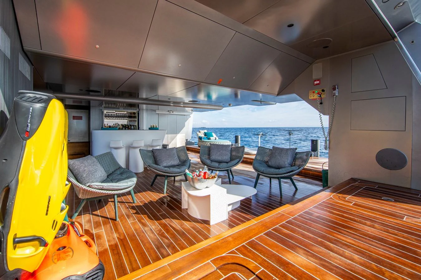The aft deck offers a stylish and comfortable seating area with a view of the ocean. aboard PACIFIC PEARL Yacht for Sale