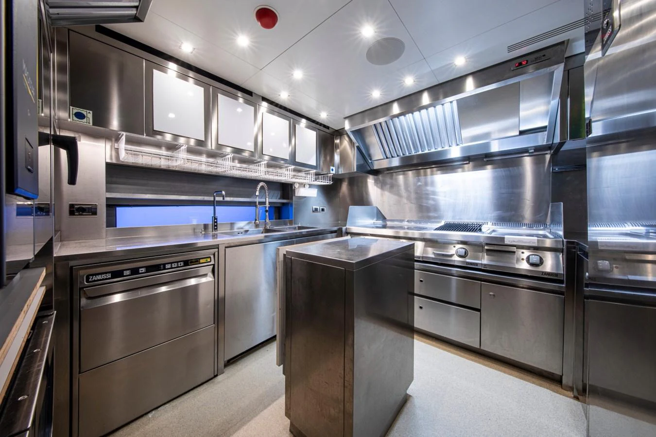 The yacht's galley is equipped with modern stainless steel appliances and ample counter space. aboard PACIFIC PEARL Yacht for Sale