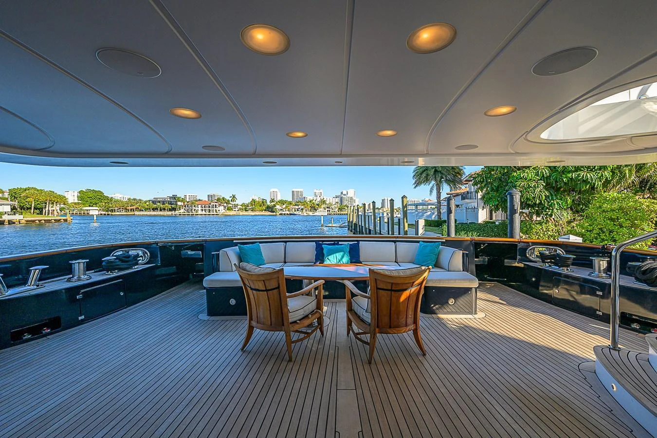 The aft deck offers a spacious and inviting area for relaxation with comfortable seating and a stunning waterfront view. aboard SEASCAPE V Yacht for Sale