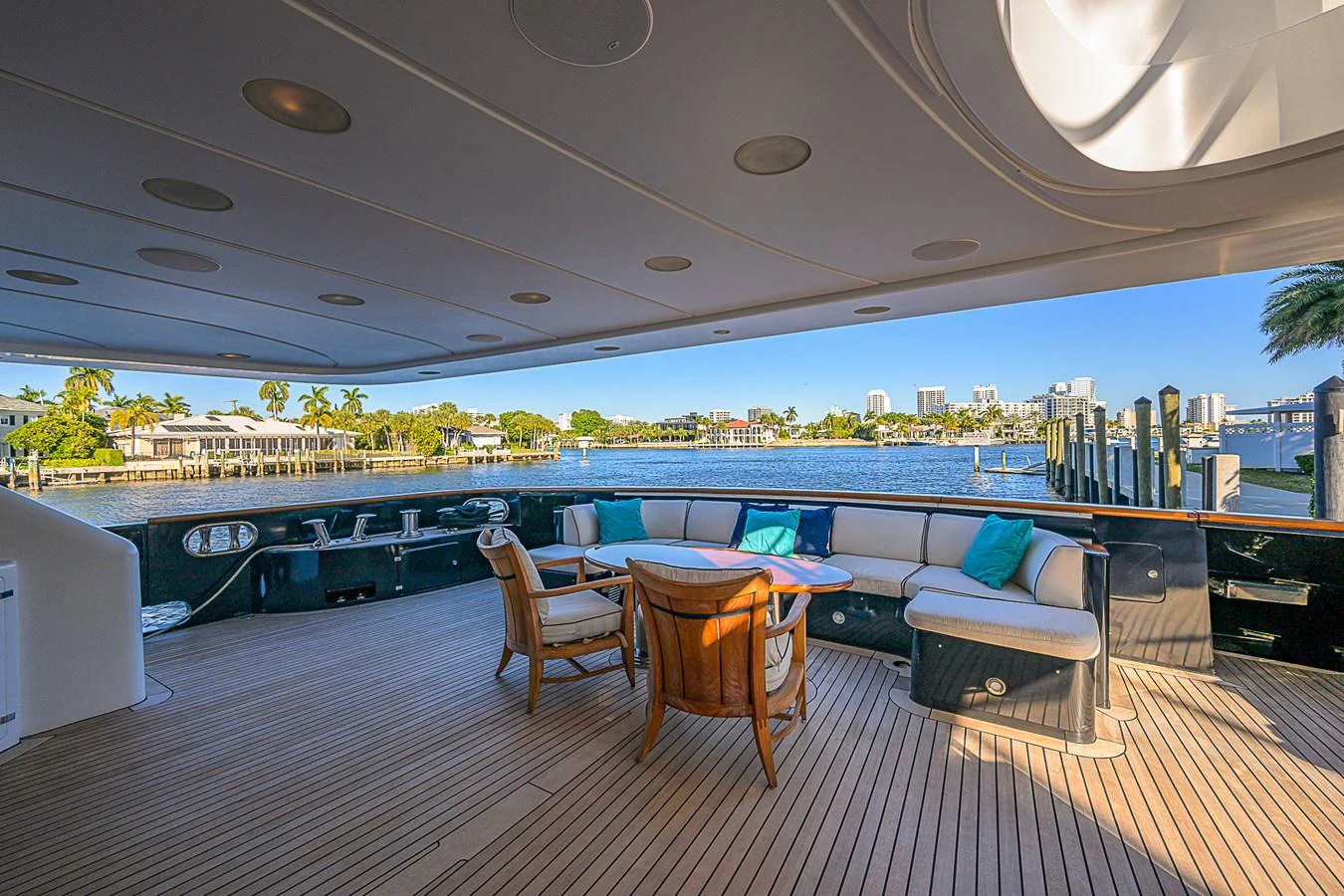 The aft deck offers a spacious and inviting area for relaxation with comfortable seating and scenic views. aboard SEASCAPE V Yacht for Sale