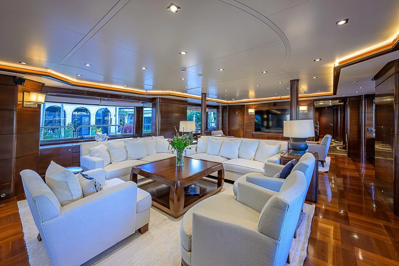 The yacht's salon features luxurious seating and elegant decor, creating a welcoming and sophisticated atmosphere. aboard SEASCAPE V Yacht for Sale