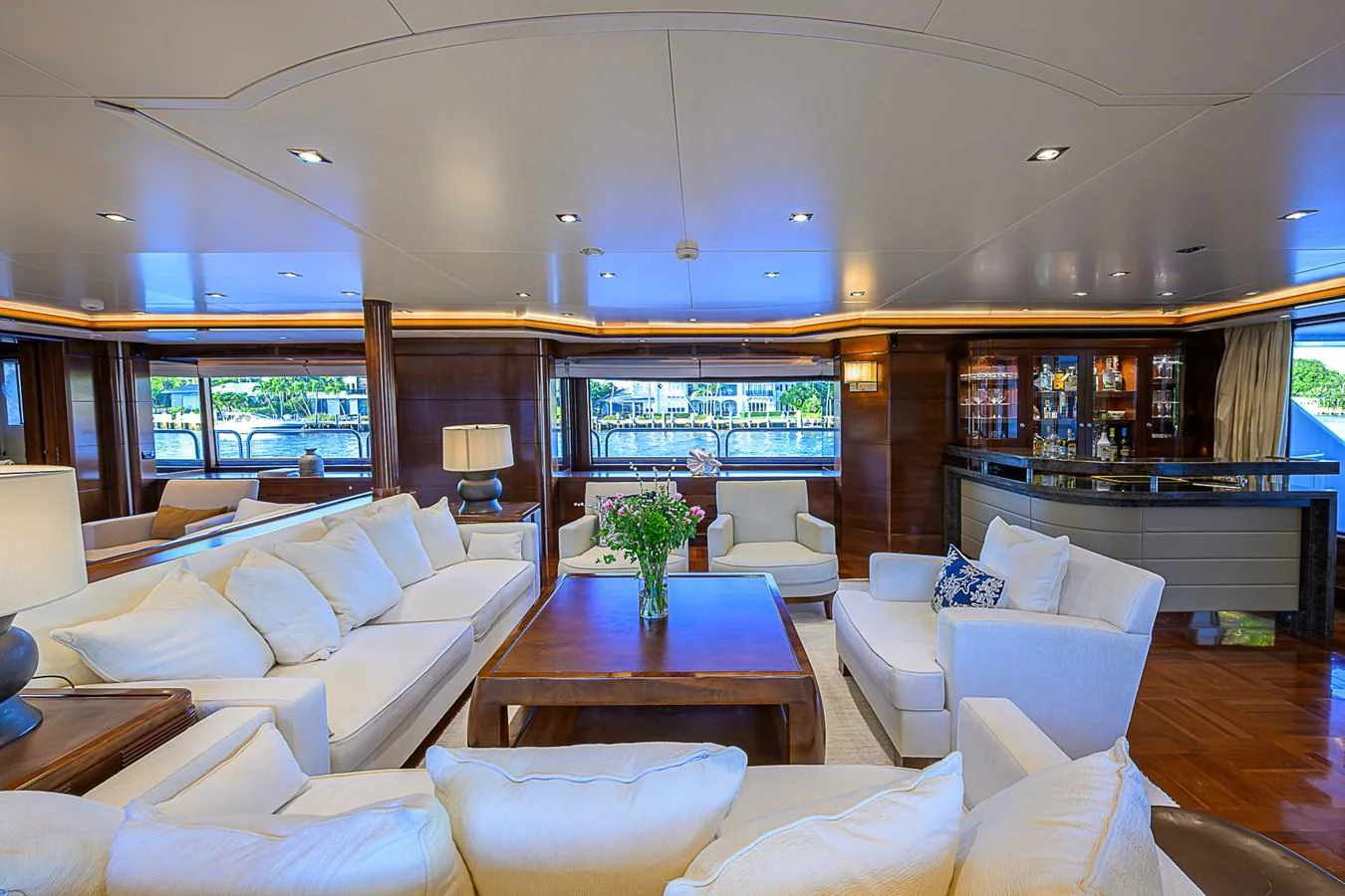 The yacht's salon features luxurious seating with ample natural light and elegant decor. aboard SEASCAPE V Yacht for Sale