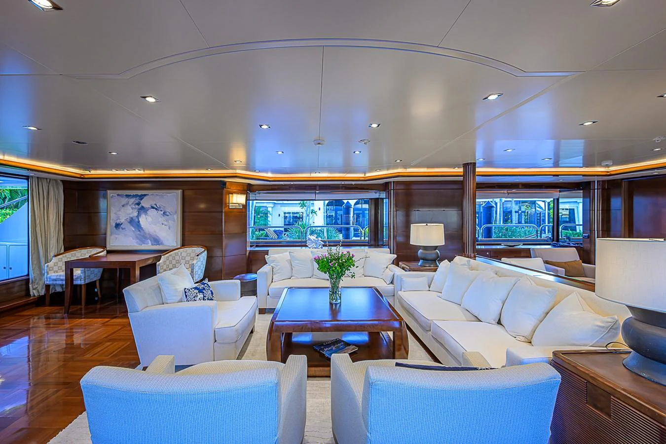 The salon features elegant seating with a blend of modern and classic design elements. aboard SEASCAPE V Yacht for Sale