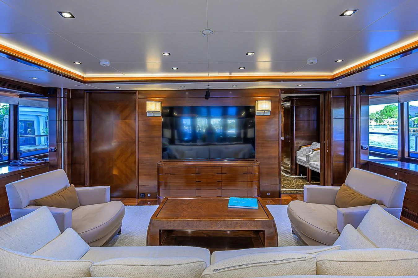 The yacht's salon features plush seating and a large flat-screen TV, creating a cozy and luxurious atmosphere. aboard SEASCAPE V Yacht for Sale