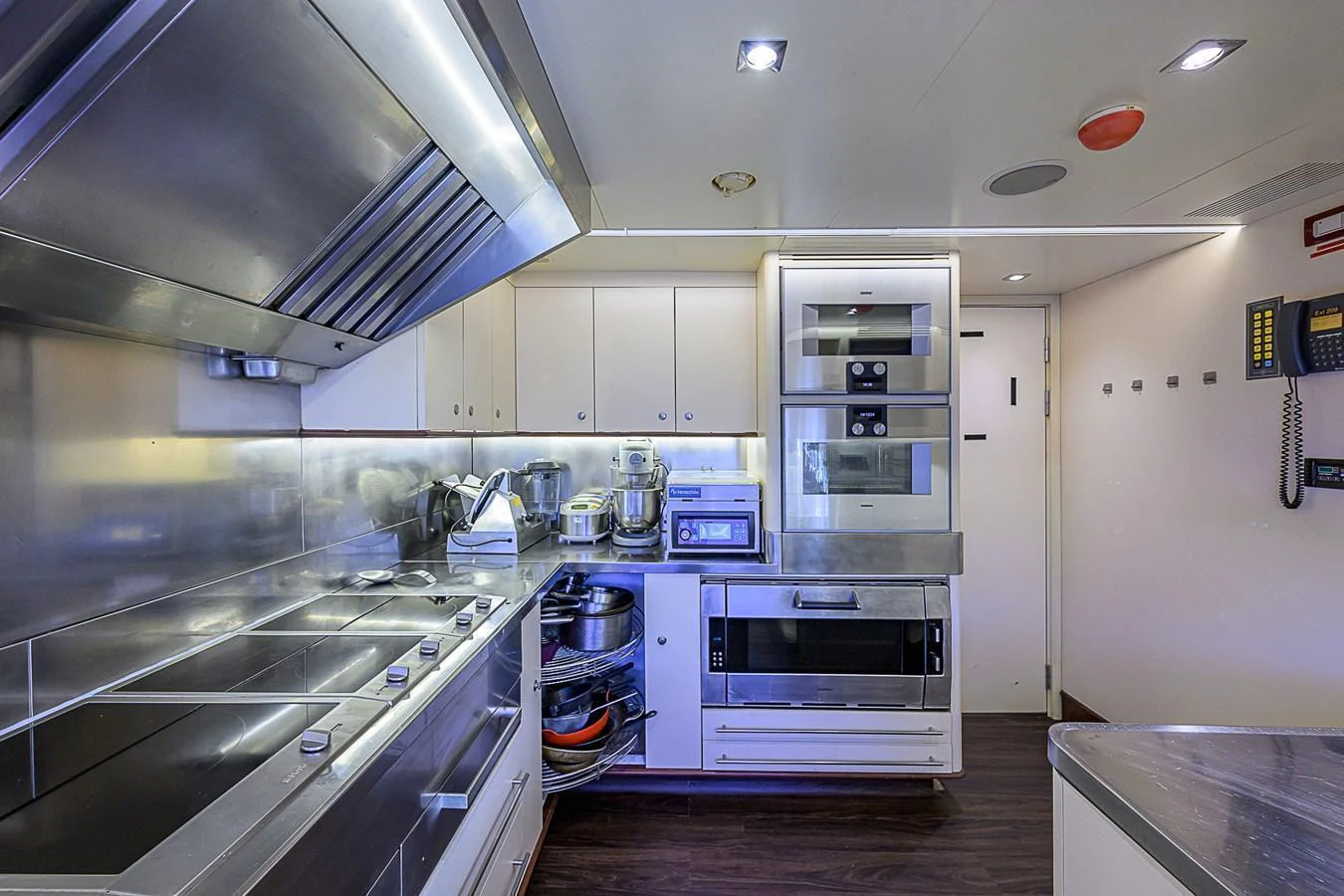 The yacht's galley is equipped with modern appliances and ample counter space for gourmet meal preparation. aboard SEASCAPE V Yacht for Sale