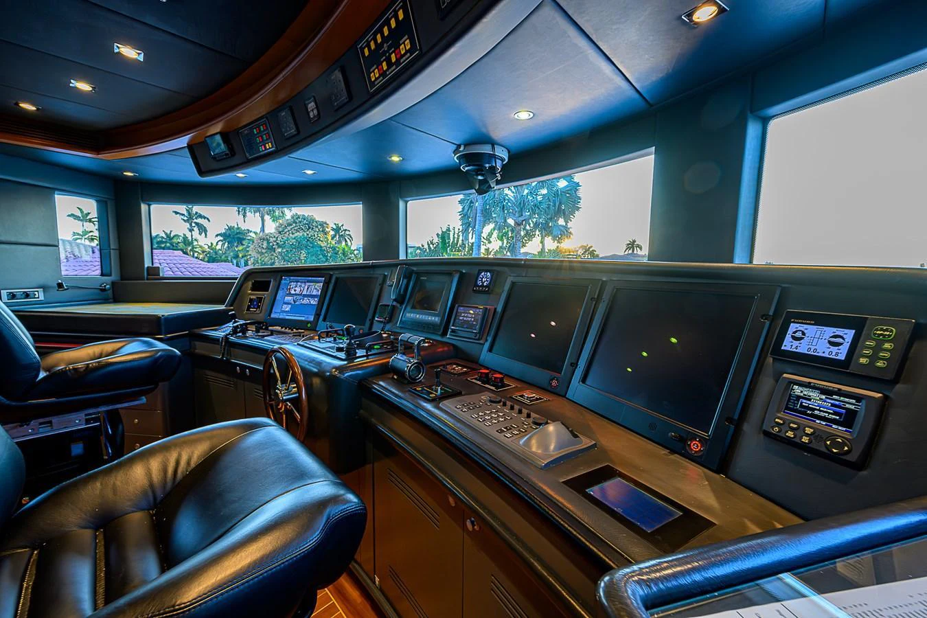 The helm station features state-of-the-art navigation equipment and luxurious seating, offering a commanding view for the captain. aboard SEASCAPE V Yacht for Sale