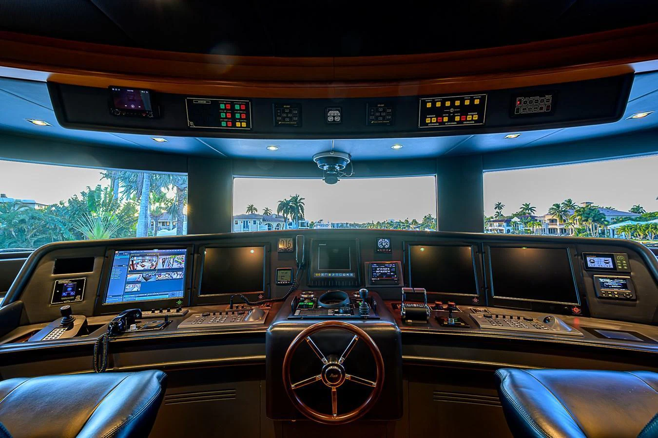 The helm station features advanced navigation and control systems with panoramic windows offering a clear view. aboard SEASCAPE V Yacht for Sale