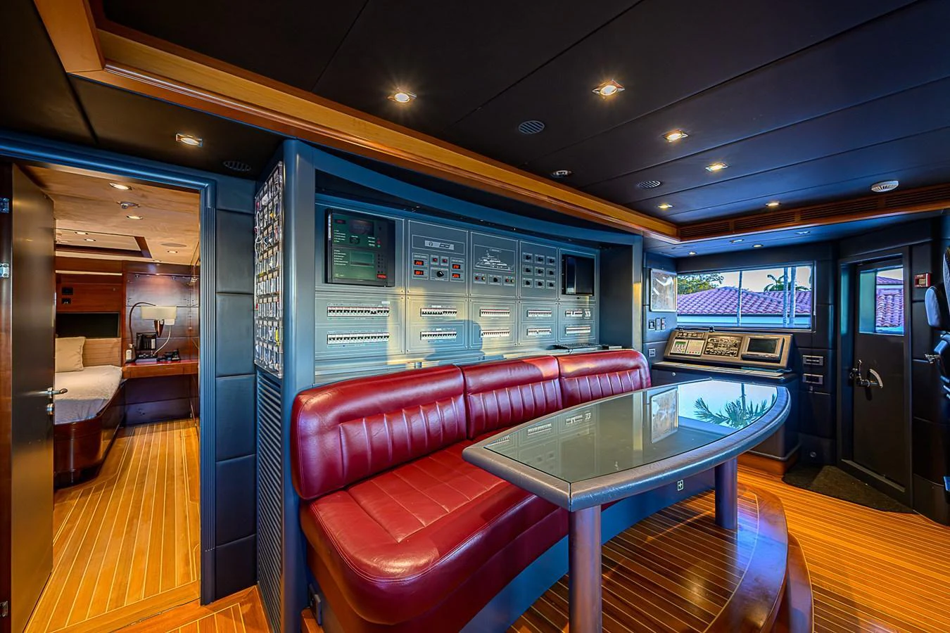 The yacht's control room features advanced navigation equipment and a comfortable seating area. aboard SEASCAPE V Yacht for Sale