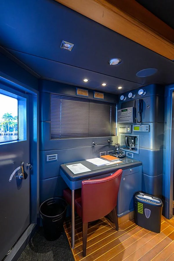 A well-appointed yacht office with modern amenities and a comfortable workspace. aboard SEASCAPE V Yacht for Sale