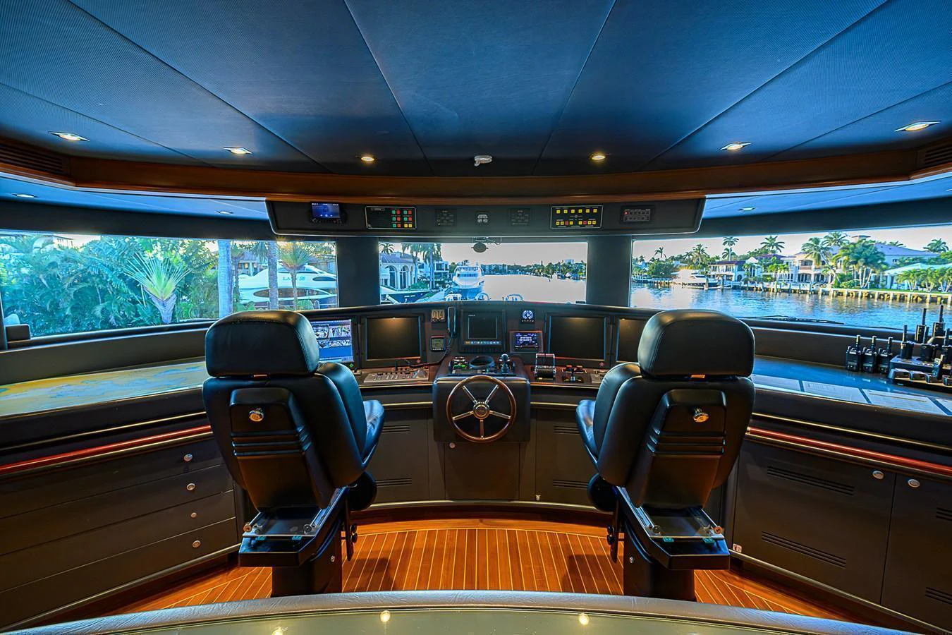 The helm station offers a commanding view with state-of-the-art navigation equipment and luxurious seating. aboard SEASCAPE V Yacht for Sale