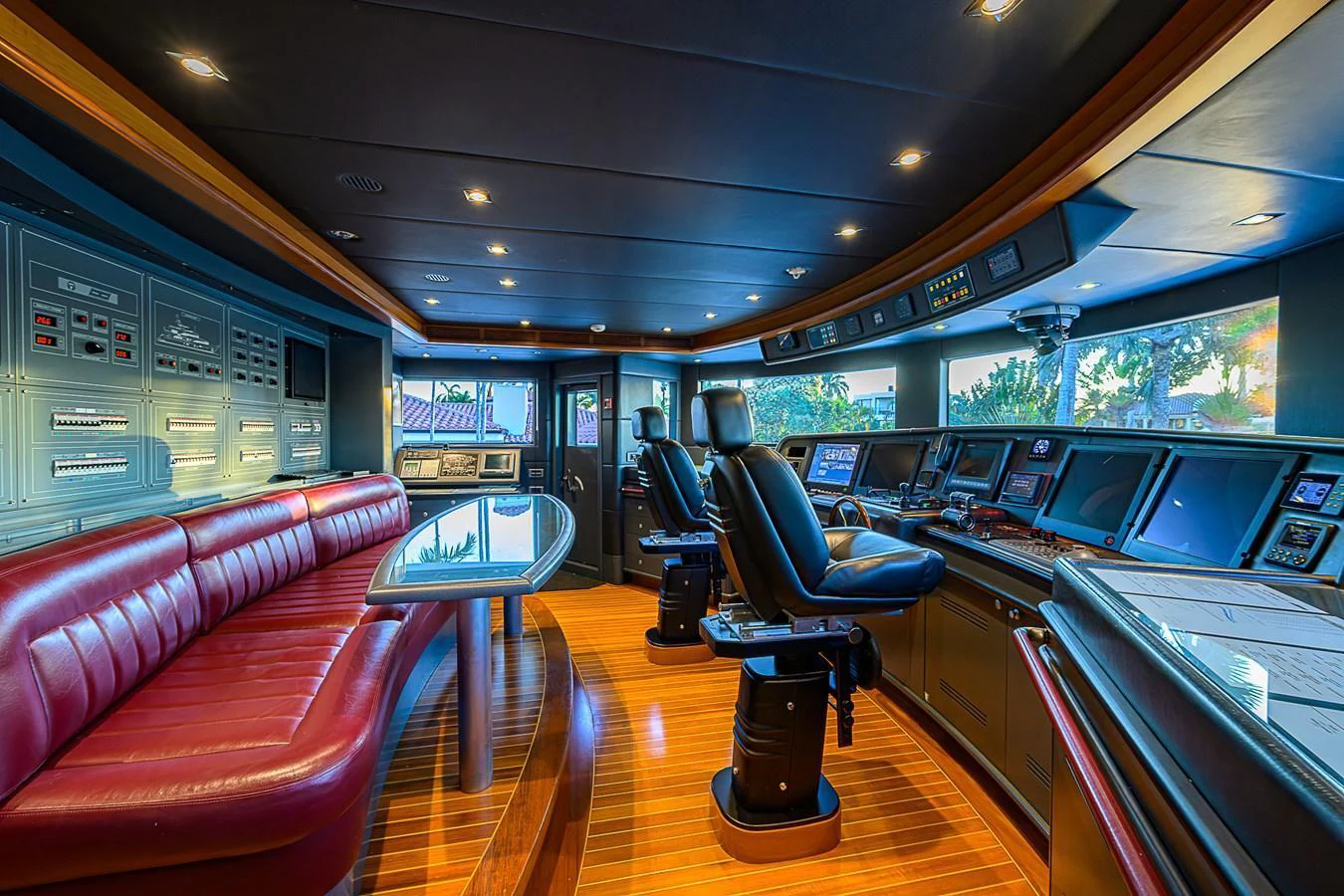 The helm features state-of-the-art navigation equipment and luxurious seating. aboard SEASCAPE V Yacht for Sale
