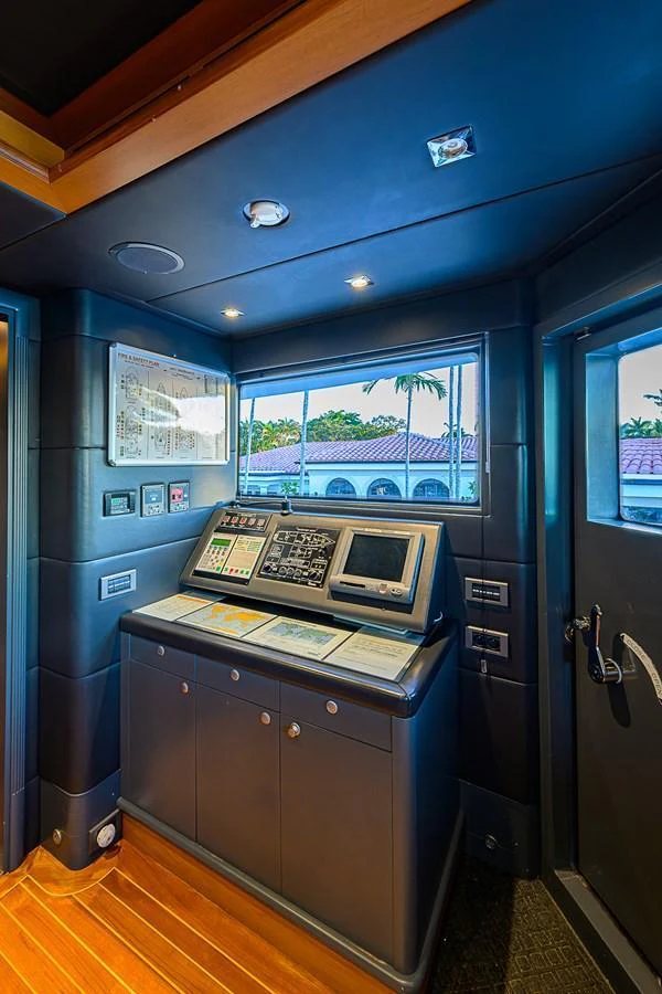 The helm station features advanced navigation equipment and a sleek, modern design. aboard SEASCAPE V Yacht for Sale