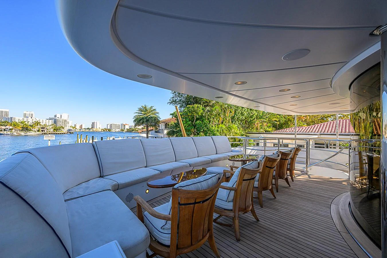 The aft deck features a spacious seating area with comfortable chairs and a stunning view of the water. aboard SEASCAPE V Yacht for Sale