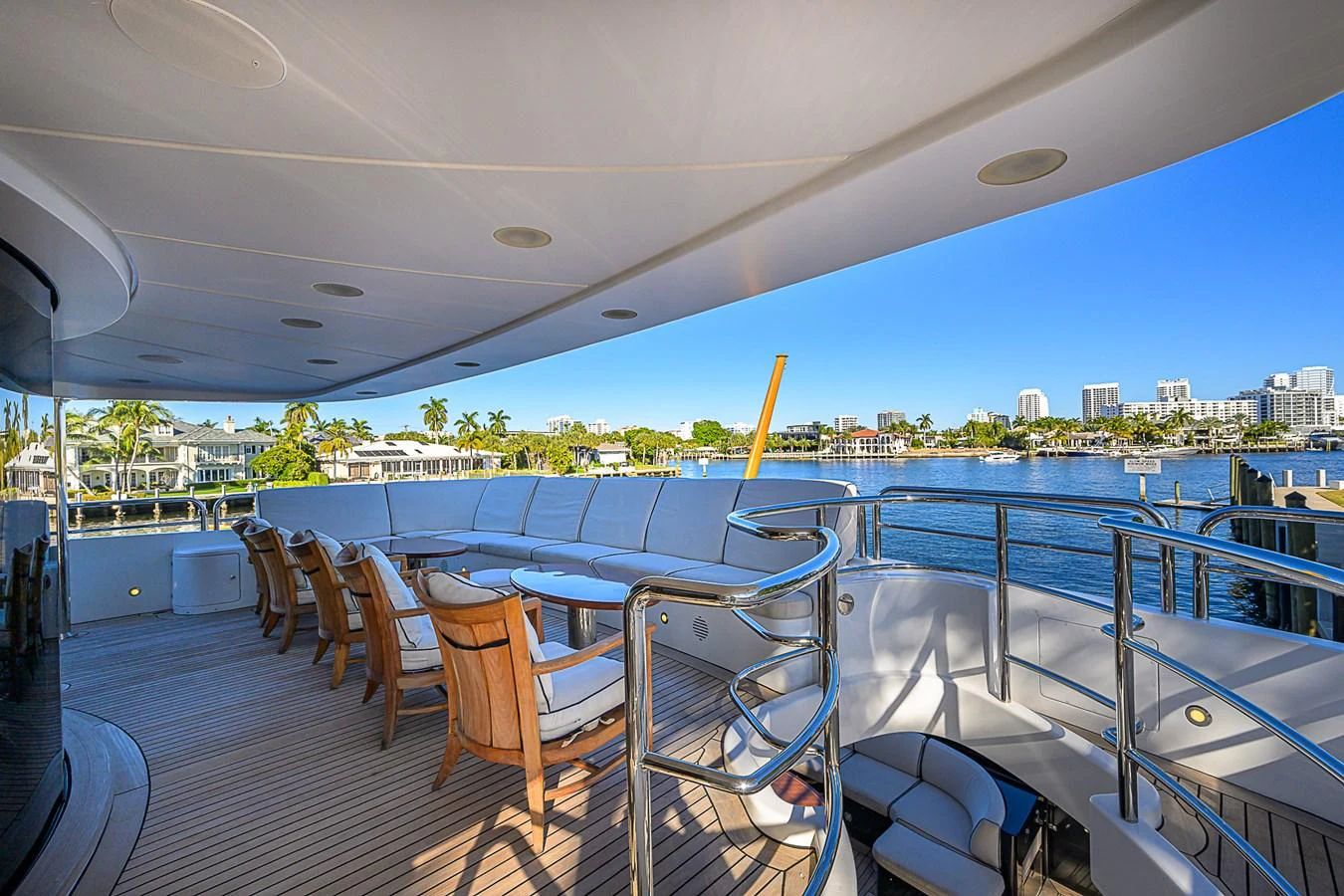 The aft deck offers a spacious and inviting area for alfresco dining and relaxation with stunning waterfront views. aboard SEASCAPE V Yacht for Sale