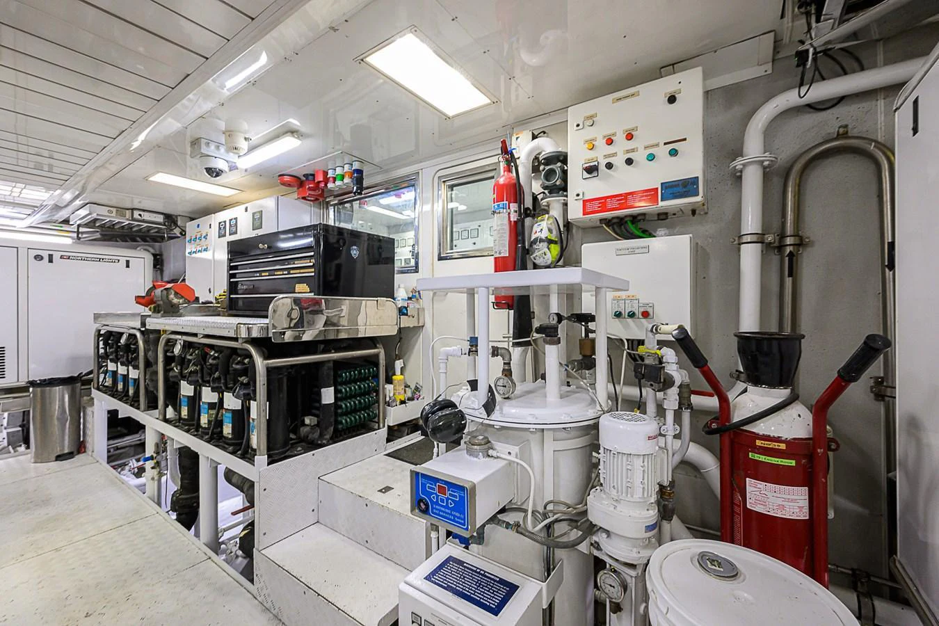 The engine room is equipped with advanced machinery and control panels, ensuring optimal performance and safety. aboard SEASCAPE V Yacht for Sale