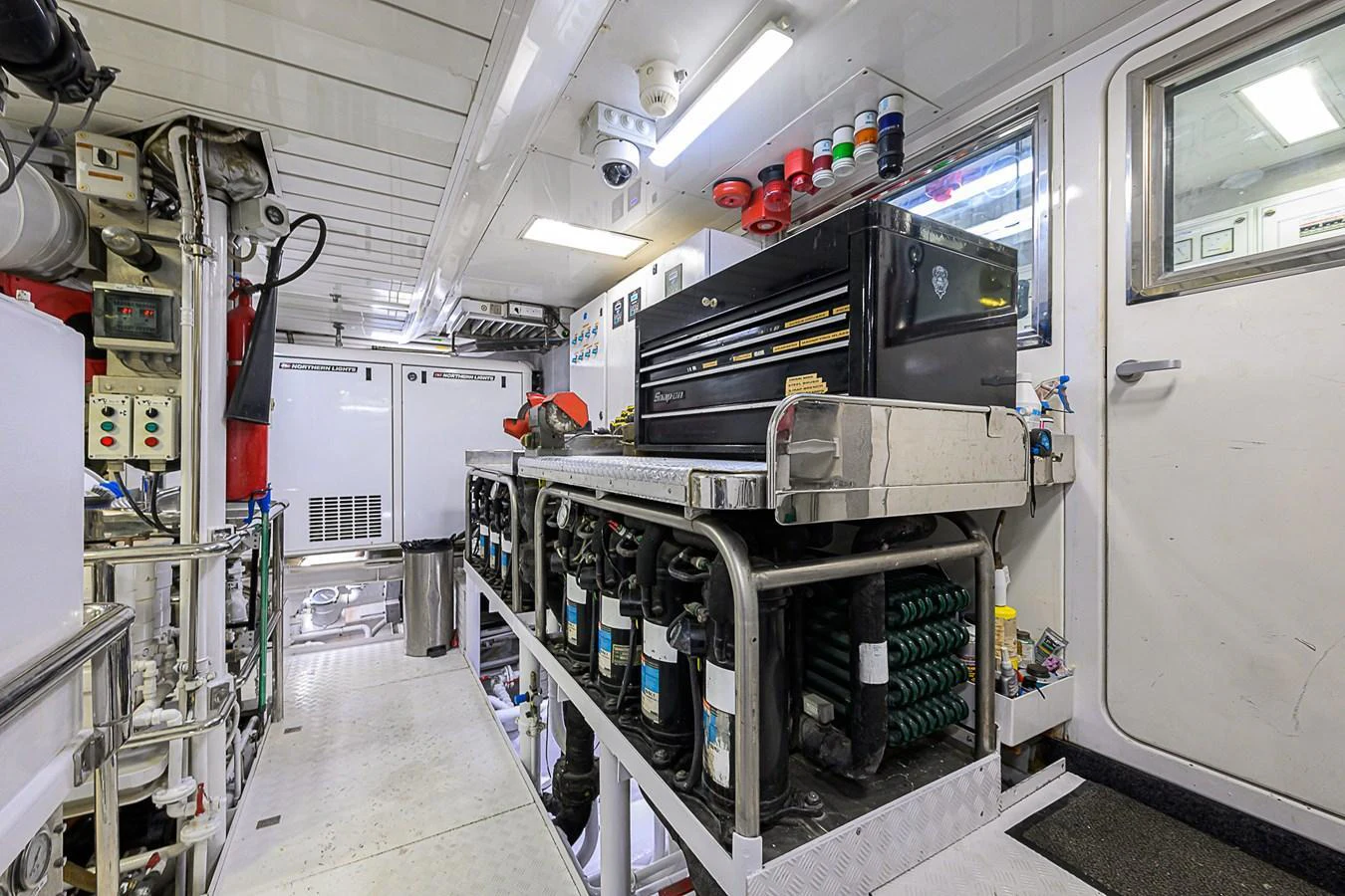 The yacht's engine room is equipped with advanced machinery and tools for optimal performance. aboard SEASCAPE V Yacht for Sale