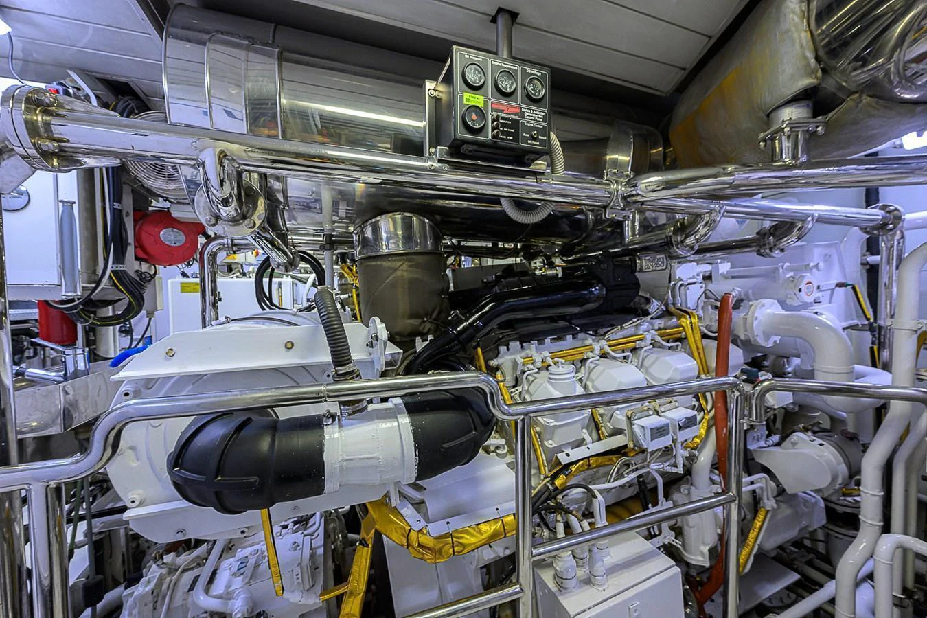 The image showcases the meticulously maintained engine room of the yacht, highlighting its advanced machinery and clean setup. aboard SEASCAPE V Yacht for Sale