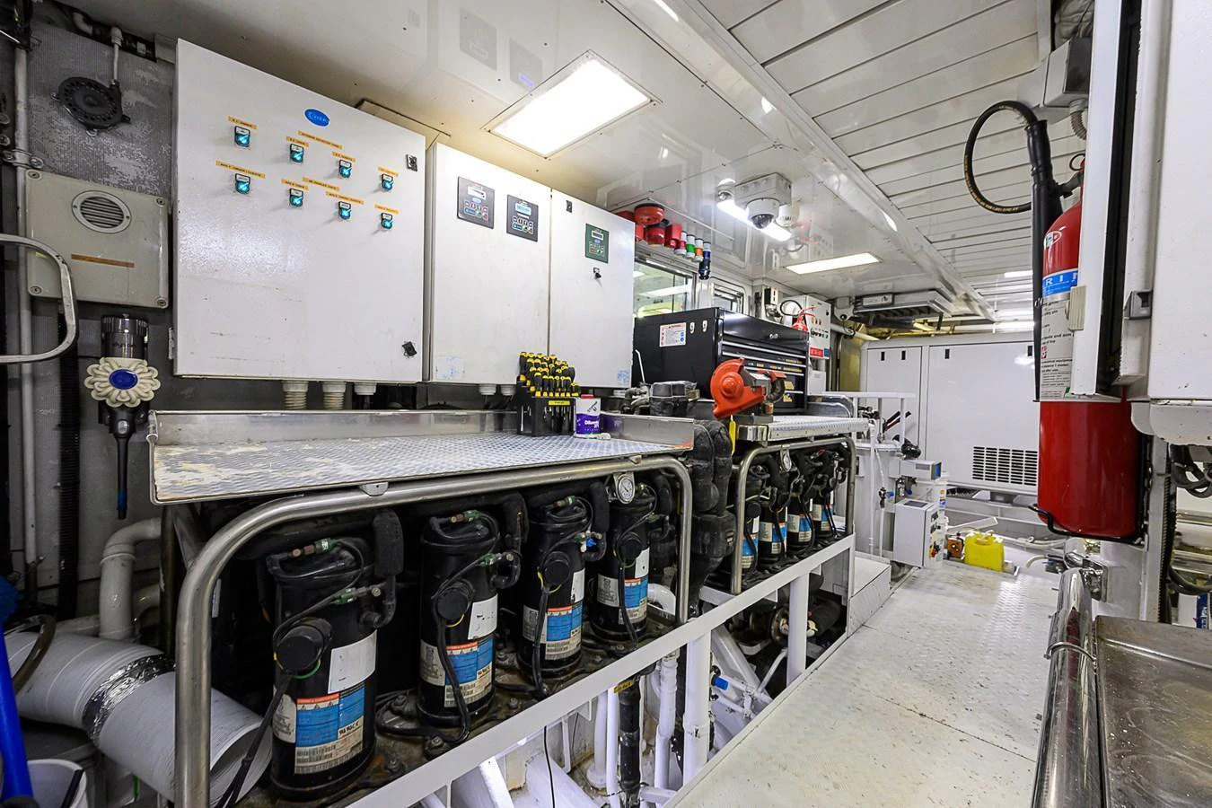 The image showcases the well-organized and meticulously maintained engine room of the yacht. aboard SEASCAPE V Yacht for Sale