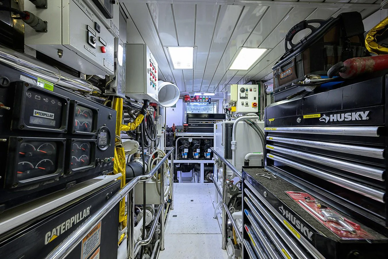 The engine room is meticulously organized with high-end equipment and tools. aboard SEASCAPE V Yacht for Sale