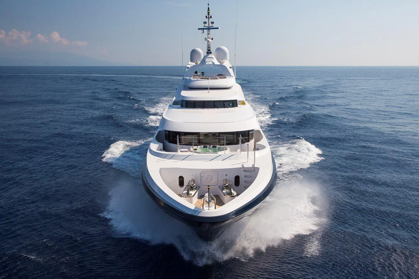 A luxurious yacht cruises through the open sea, showcasing its sleek design and powerful presence. aboard ALASKA OF GEORGE TOWN Yacht for Sale