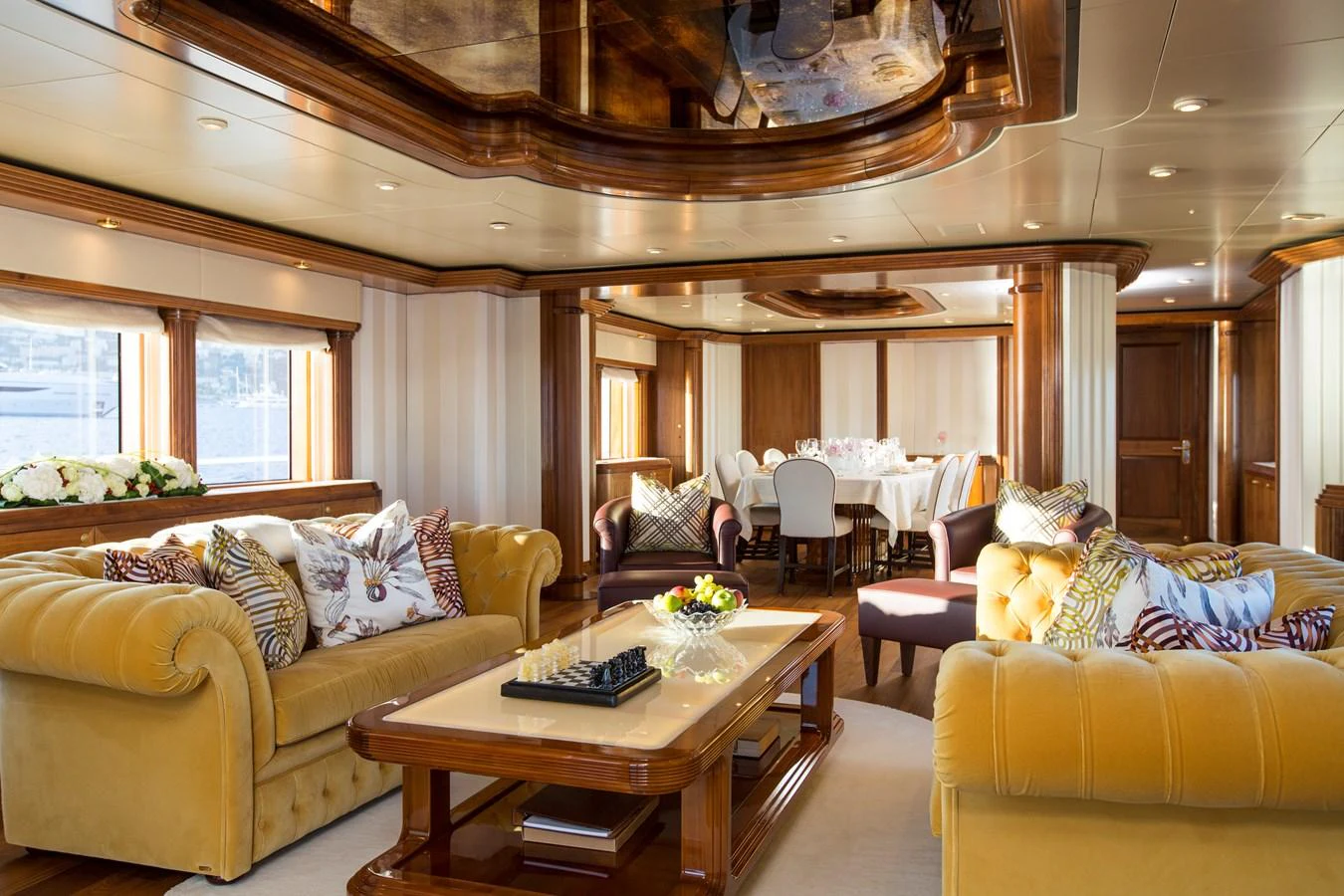 The yacht's salon features luxurious seating and elegant decor, creating a warm and inviting atmosphere. aboard ALASKA OF GEORGE TOWN Yacht for Sale