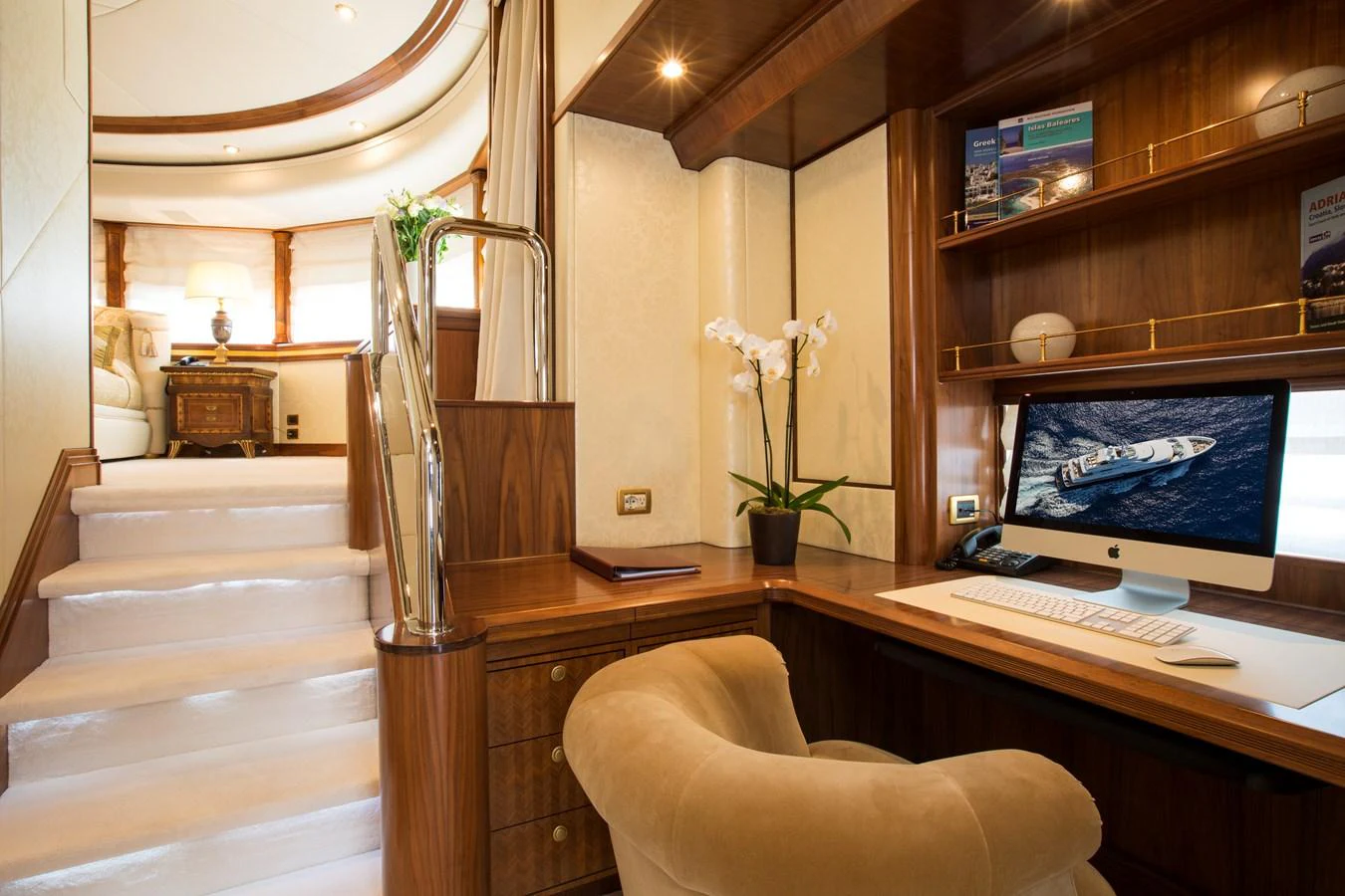 A luxurious yacht office with elegant wood finishes and modern amenities. aboard ALASKA OF GEORGE TOWN Yacht for Sale