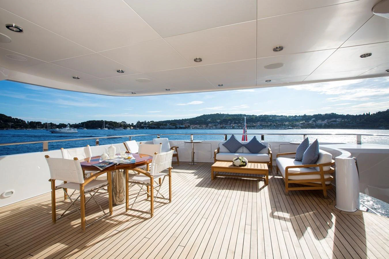 The aft deck offers a spacious and inviting area for alfresco dining and relaxation with stunning views of the water. aboard ALASKA OF GEORGE TOWN Yacht for Sale