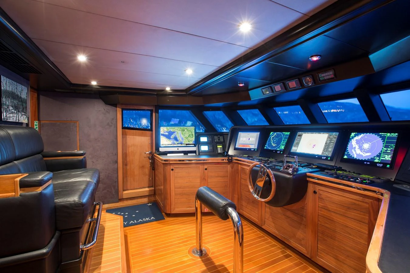 The helm station features advanced navigation equipment and luxurious seating. aboard ALASKA OF GEORGE TOWN Yacht for Sale