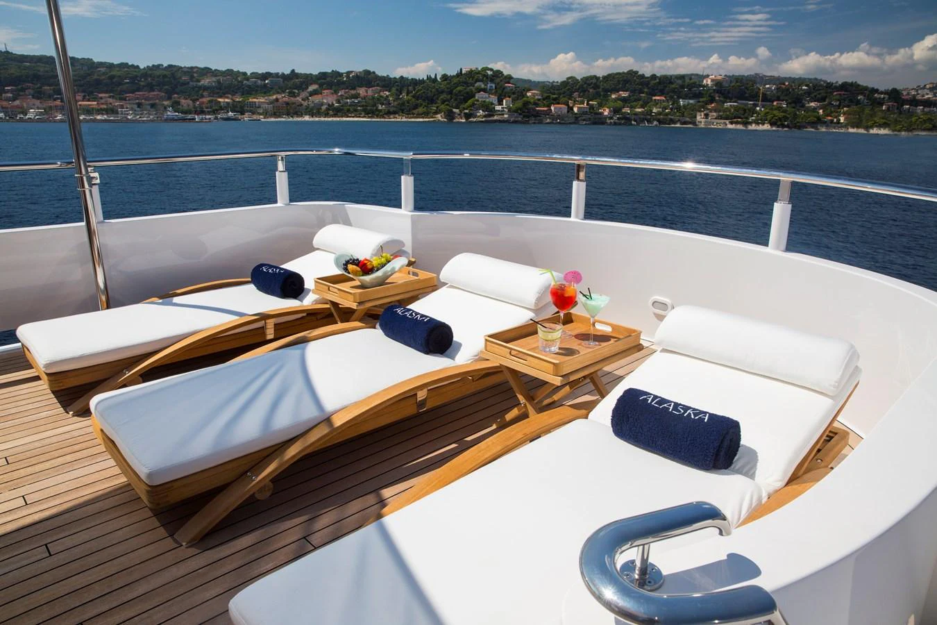 The sundeck offers luxurious sun loungers with plush cushions and refreshing beverages, perfect for relaxation. aboard ALASKA OF GEORGE TOWN Yacht for Sale
