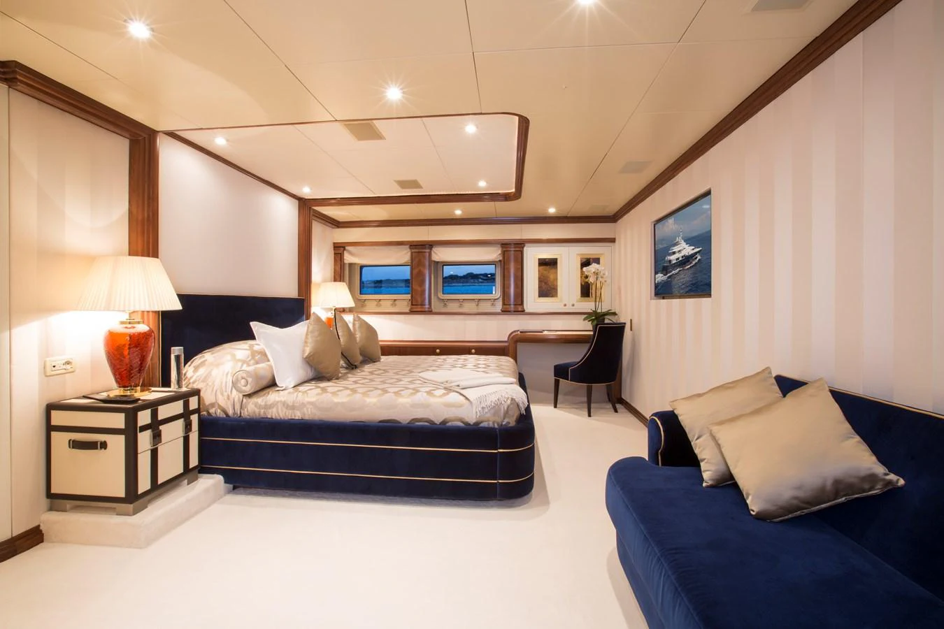 The master stateroom features a luxurious bed, elegant furnishings, and ample natural light. aboard ALASKA OF GEORGE TOWN Yacht for Sale