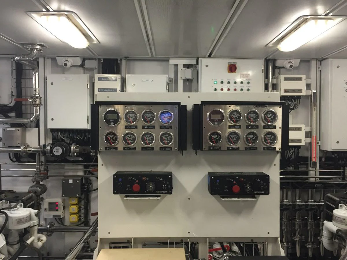 The image showcases the yacht's well-equipped engine room with various control panels and gauges. aboard ALASKA OF GEORGE TOWN Yacht for Sale