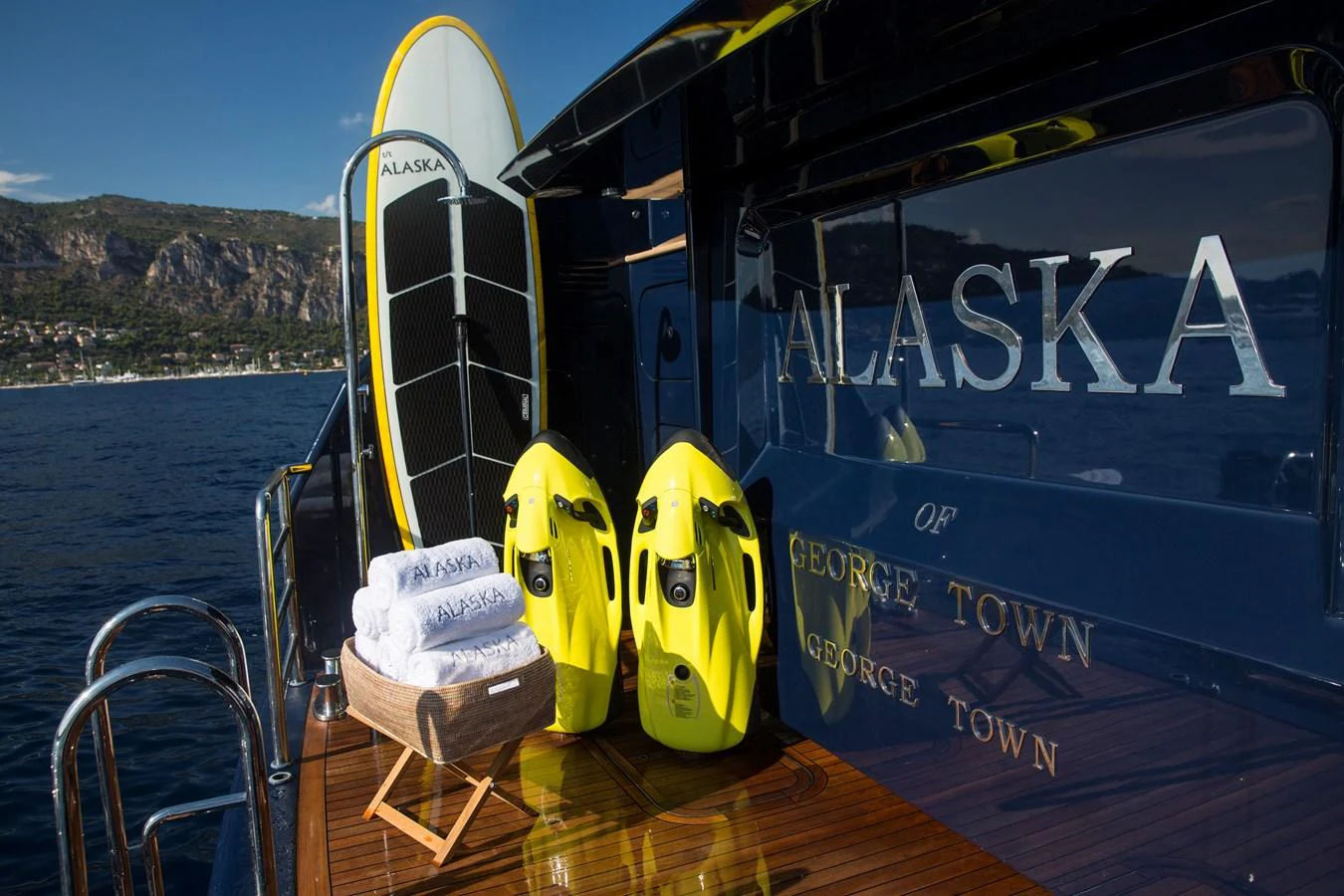 The aft deck features water sports equipment and a basket of fresh towels, ready for adventure. aboard ALASKA OF GEORGE TOWN Yacht for Sale