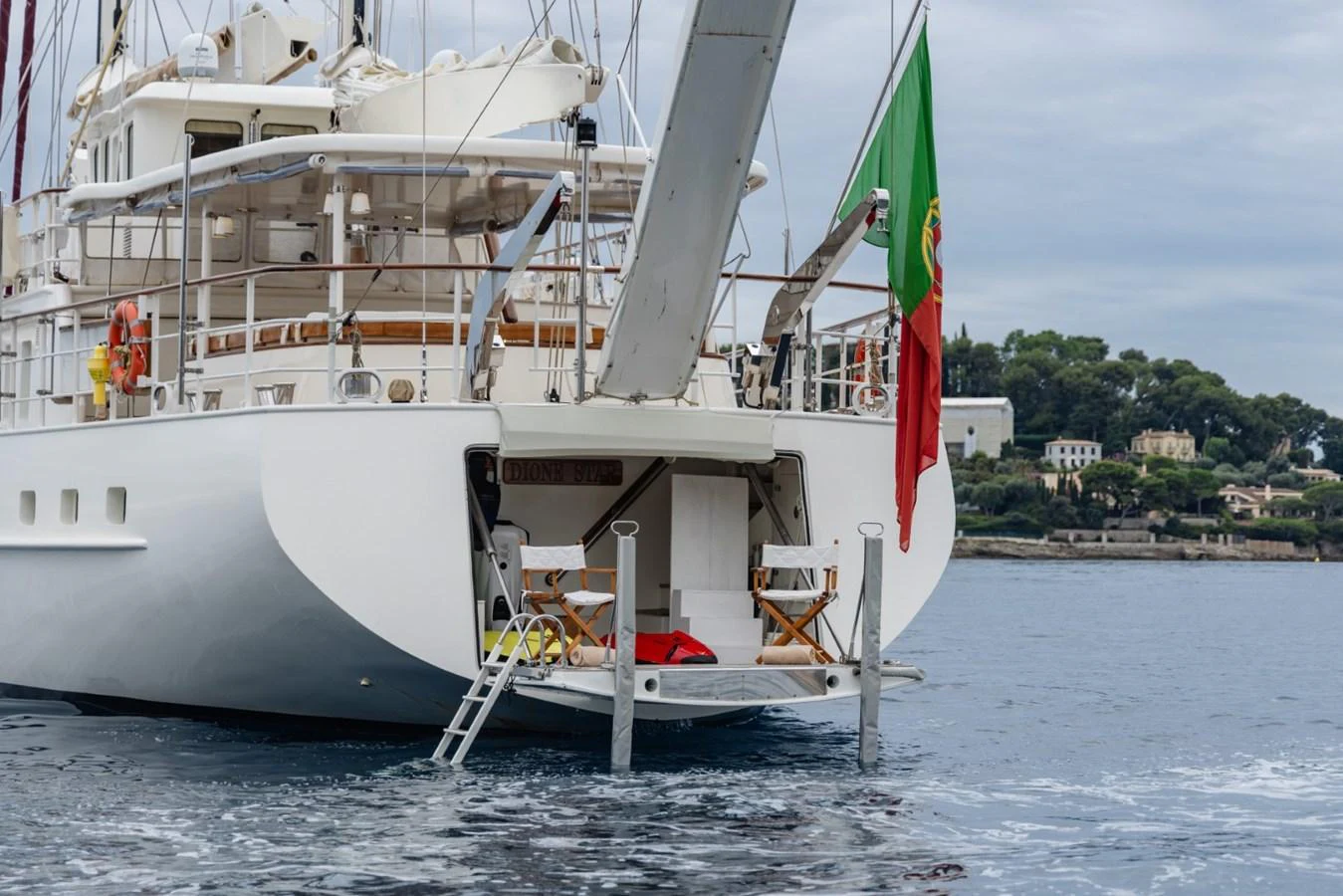 The yacht's stern features a swim platform with seating and easy access to the water. aboard DIONE STAR Yacht for Sale